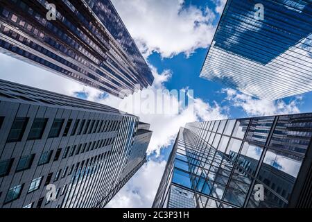 Business and finance concept, looking up at modern office building architecture in the financial district of Toronto, Ontario, Canada.