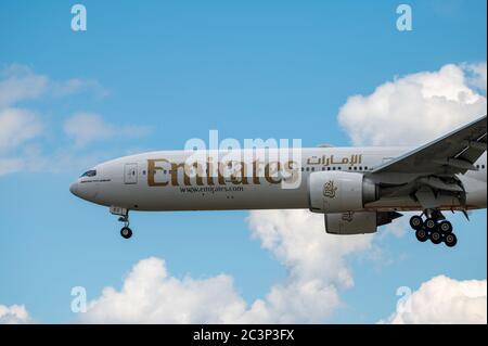 Emirates Airline Boeing 777-300ER wide body aircraft A6-EGU approaching to land at EDDF Frankfurt airport in Germany Stock Photo