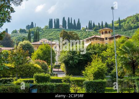 Valdobbiadene, Italy - August 11, 2019: Picturesque hills with vineyards of the Prosecco sparkling wine region and historic buildings in Valdobbiadene Stock Photo