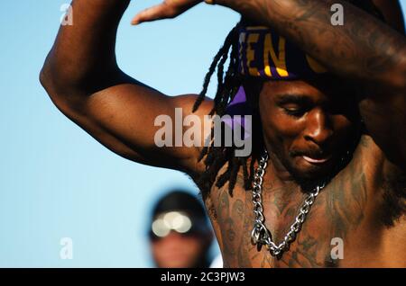 MIAMI - MARCH 23, 2019: A young man from the Omega Psi Phi fraternity performs in a step show at a Spring Break party on South Beach. Stock Photo