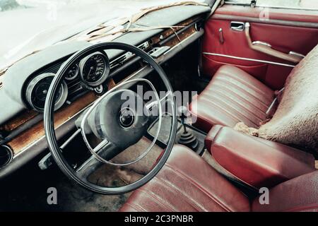 Inside interior of Old rusty grunge retro vintage car, abandoned auto. Stock Photo