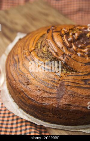 Close-up of a homemade chocolate and vanilla striped zebra cake Stock Photo