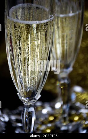 two glasses of champagne against a dark background Stock Photo