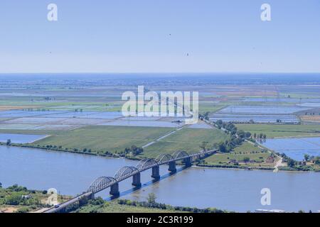 The farming fields outside Vila Franca de Xira by the Tagus River, with the Marechal Carmona bridge. Stock Photo