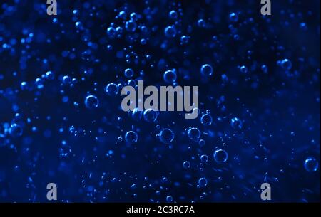 Background of the bubble in dark blue water Stock Photo