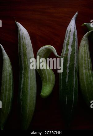 The organic snake luffa on the wooden table Stock Photo