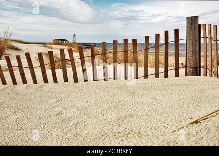 Sand and wind fencing on the sand dunes of North Carolina to help hold the dunes from the movement of the sand and snow all winter Stock Photo