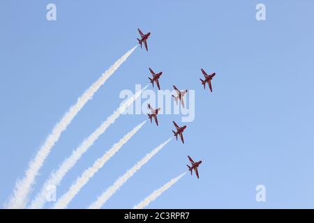 Operating as a seven-ship team in 2012, the Royal Air Force aerobatic display team, the Red Arrows, perform at the RAF Leuchars Airshow. Stock Photo