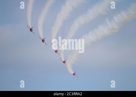 Operating as a seven-ship team in 2012, the Royal Air Force aerobatic display team, the Red Arrows, perform at the RAF Leuchars Airshow. Stock Photo