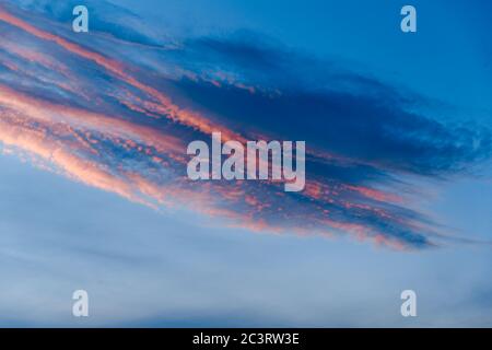 Dark blue sky before sunset with beautiful awesome clouds. Colorful Sunset Background Stock Photo