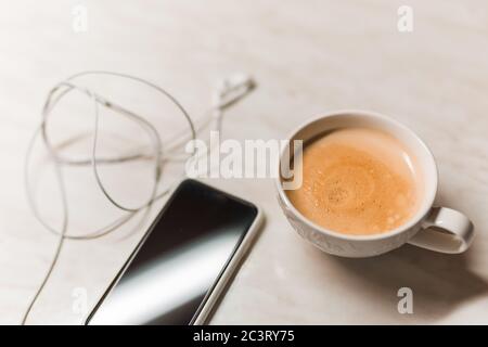 Phone and coffee on wood blank space Stock Photo