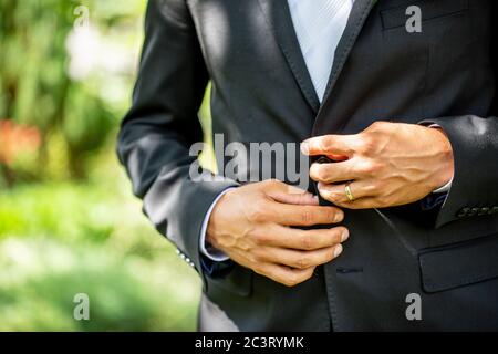 Boutonniere on the lapel of the groom Stock Photo