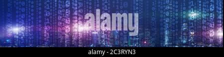 Binary computer code virtual city skyline. Matrix Mixed Media Background. Stock Photo