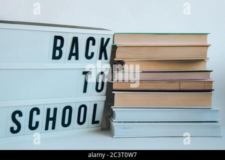 lightbox with BACK TO SCHOOL text and books on white background Stock Photo