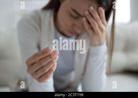 Woman took off wedding ring from finger closeup image Stock Photo