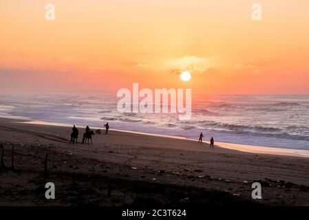 Last sunlight of the day with sunset over the Atlantic Ocean from Agadir beach, Morocco, Africa Stock Photo