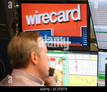 22 June 2020, Hessen, Frankfurt/Main: On the television monitor of a stockbroker on the trading floor of the Frankfurt Stock Exchange, the news that the suspicion of fraud at payment service provider Wirecard has been substantiated is playing out. The accounting scandal surrounding payment service provider Wirecard dragged its shares even deeper into the downward spiral on Monday. In early trading, they lost a further almost 38 percent to 15.10 euros, after having already slumped by up to 82 percent on Thursday and Friday. The stock market value thus shrank to almost 1.9 billion euros, which m Stock Photo