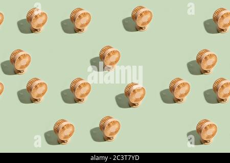 Minimal summer background of mini fan seamless pattern on green background. Isometric trendy style with shadows Stock Photo