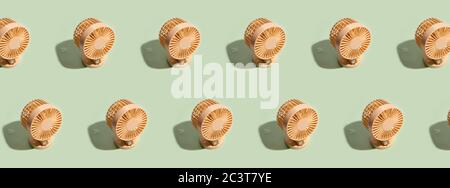 Minimal summer background of mini fan pattern on green background. Isometric trendy style with shadows Stock Photo
