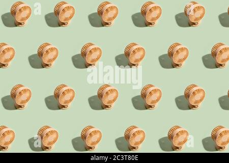 Minimal summer background of mini fan pattern on green background. Isometric trendy style with shadows Stock Photo