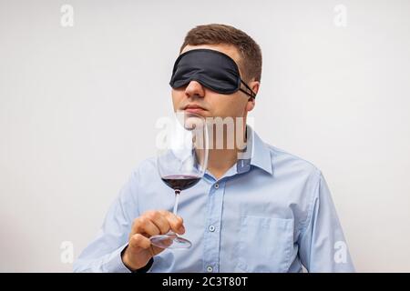 Silhouette of man degusting wine. Isolated on white Stock Photo