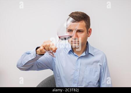 Silhouette of man degusting wine. Isolated on white Stock Photo