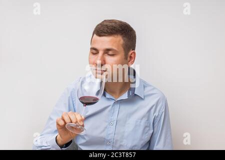 Silhouette of man degusting wine. Isolated on white Stock Photo