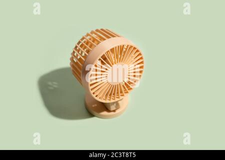 Minimal summer background of mini fan on green background. Isometric trendy style with shadows Stock Photo