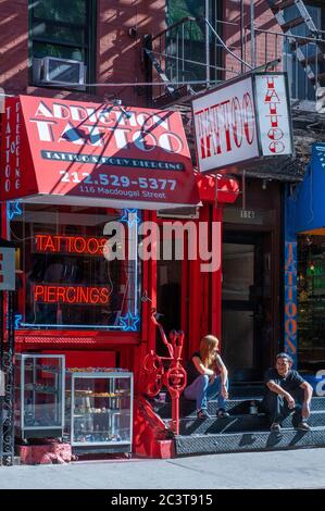 One of the tattoo shops in the Greenwich Village, on Mac Dougal St., Manhattan. Here there are many places where you can get a tattoo or piercing. If Stock Photo