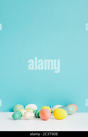 Coloeful easter eggs on pastel color background with space Stock Photo ...