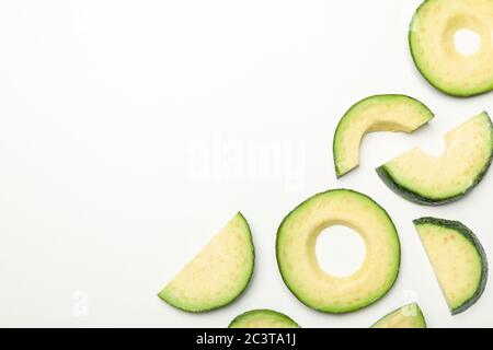 Flat lay with avocado slices on white background, top view Stock Photo