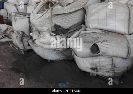 pile of cement bags in a factory, Jeddah, Saudi Arabia, feb 2020 Stock Photo