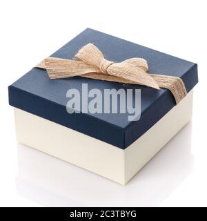 Square gift box with blue lid and burlap ribbon bow. Isolated on white. Stock Photo