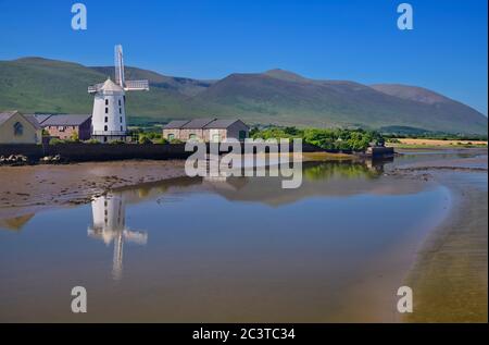 Ireland, County Kerry, Blennerville, Blennerville Windmill seen from across Tralee Bay estuary with its reflection in the water and mountains of the Dingle Peninsula in the background. Stock Photo