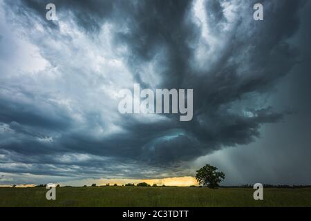 Supercell storm clouds with intense tropic rain Stock Photo