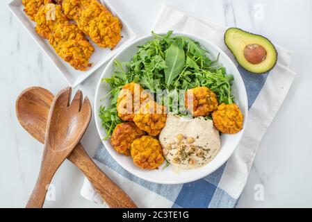 Healthy vegetarian buddha bowl with baked sweet potato, falafel Stock Photo