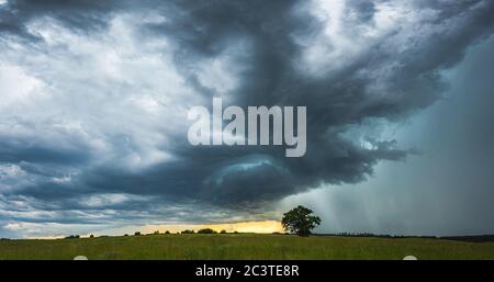 Supercell storm clouds with intense tropic rain Stock Photo