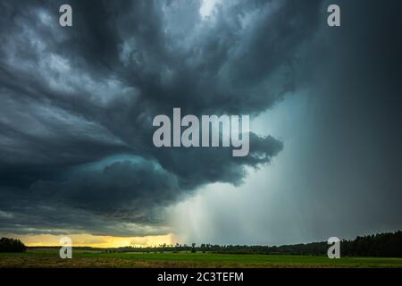 Supercell storm clouds with intense tropic rain Stock Photo