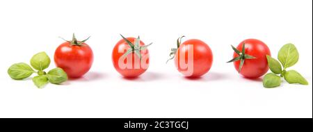 Fresh ripe red cherry tomatoes with green basil leaves in a row, isolated on white background, vegetable pattern Stock Photo