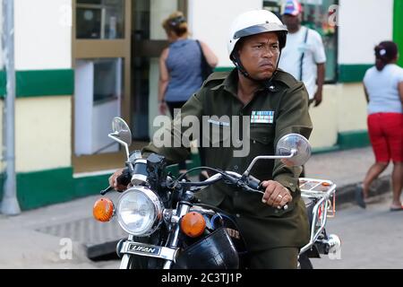 Santiago de Cuba, CUBA - November 28: man riding motorcycle on the road ni Santiago de Cuba, front view, on November 28, 2016 Stock Photo