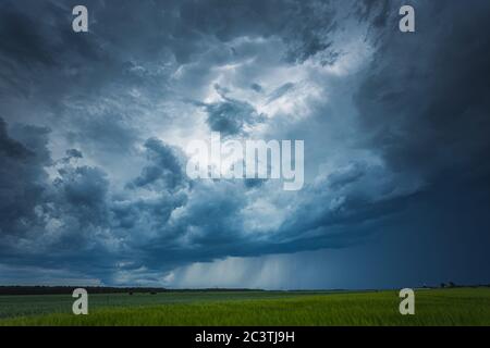 Supercell storm clouds with intense tropic rain Stock Photo