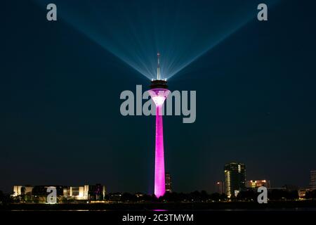 Television Tower from Düsseldorf, Germany with lightshow. Fernsehturm von Düsseldorf mit Lichtshow. Werbung für den 5G Standard. Stock Photo