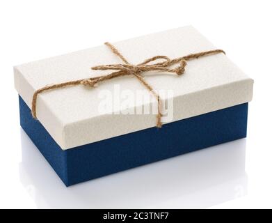 Cardboard box on a white background. Gift box with sacking ribbon. Stock Photo