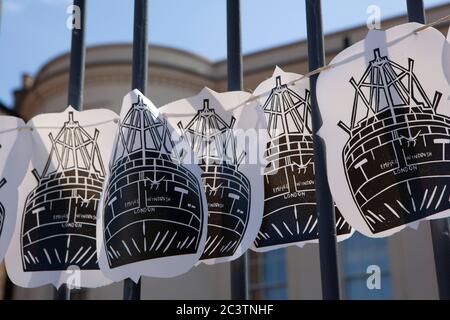 London, UK, 22 June 2020: To mark the 72nd anniversary of the day the Empire Windrush docked, carrying 1,027 passengers. Online events were held at 10.27am but Windrush Square in Brixton as largely deserted. The gates of the Black Cultural Archives were decked with flags and Empire Windrush banners. Anna Watson/Alamy Stock Photo