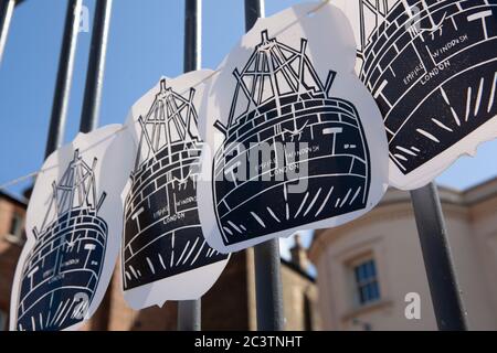 London, UK, 22 June 2020: To mark the 72nd anniversary of the day the Empire Windrush docked, carrying 1,027 passengers. Online events were held at 10.27am but Windrush Square in Brixton as largely deserted. The gates of the Black Cultural Archives were decked with flags and Empire Windrush banners. Anna Watson/Alamy Stock Photo