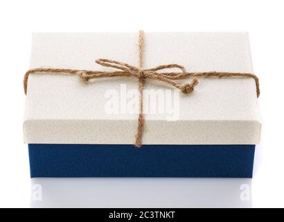 Cardboard box on a white background. Gift box with sacking ribbon. Stock Photo