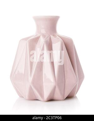 Decorative ribbed vase of pink color on a white background. Stock Photo