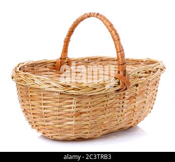 Oval brown wicker basket made of natural vine. Isolated. Stock Photo