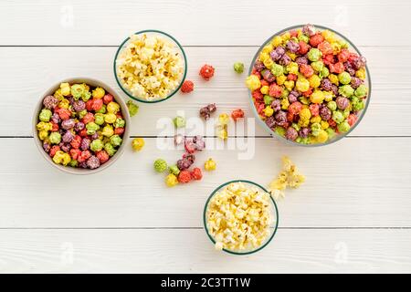 Flavored popcorn on white background top view Stock Photo