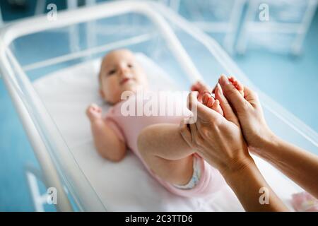 Portrait of beautiful loving mom playing first games with her baby Stock Photo